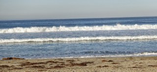 Pacific Ocean, a calm day, mild waves.