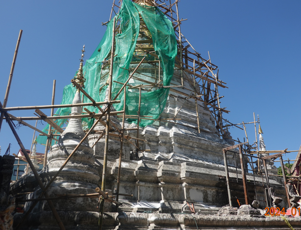 Pagoda (chedi) under rennovation with scaffolding at Wat Buppharam, Chiang Mai, Thailand