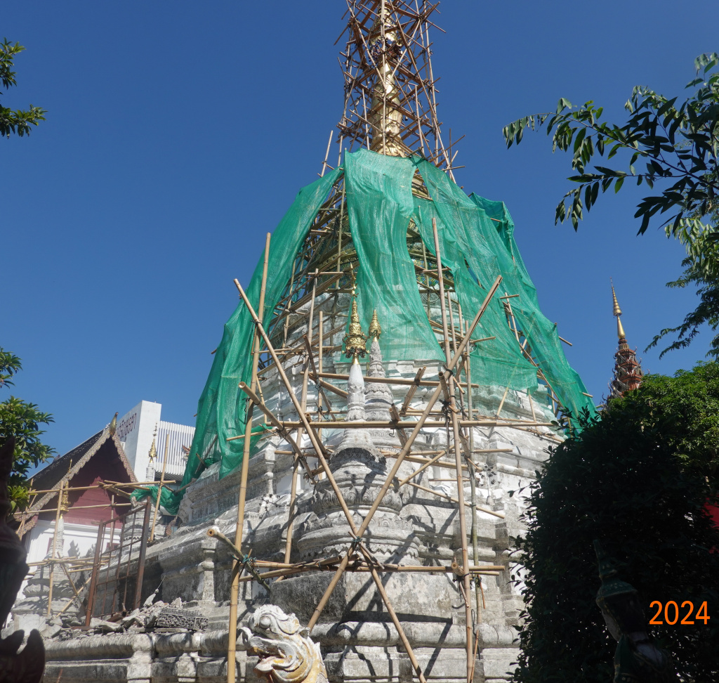 Pagoda (chedi) under rennovation with scaffolding at Wat Buppharam, Chiang Mai, Thailand