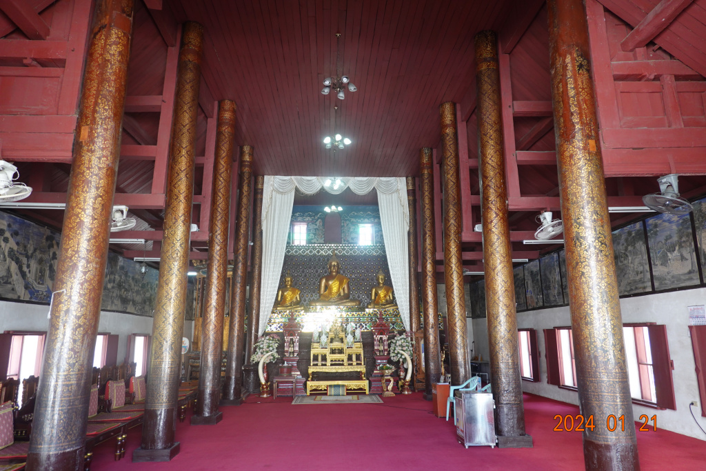Inside larger worship hall with columns at Wat Buppharam, Chiang Mai, Thailand